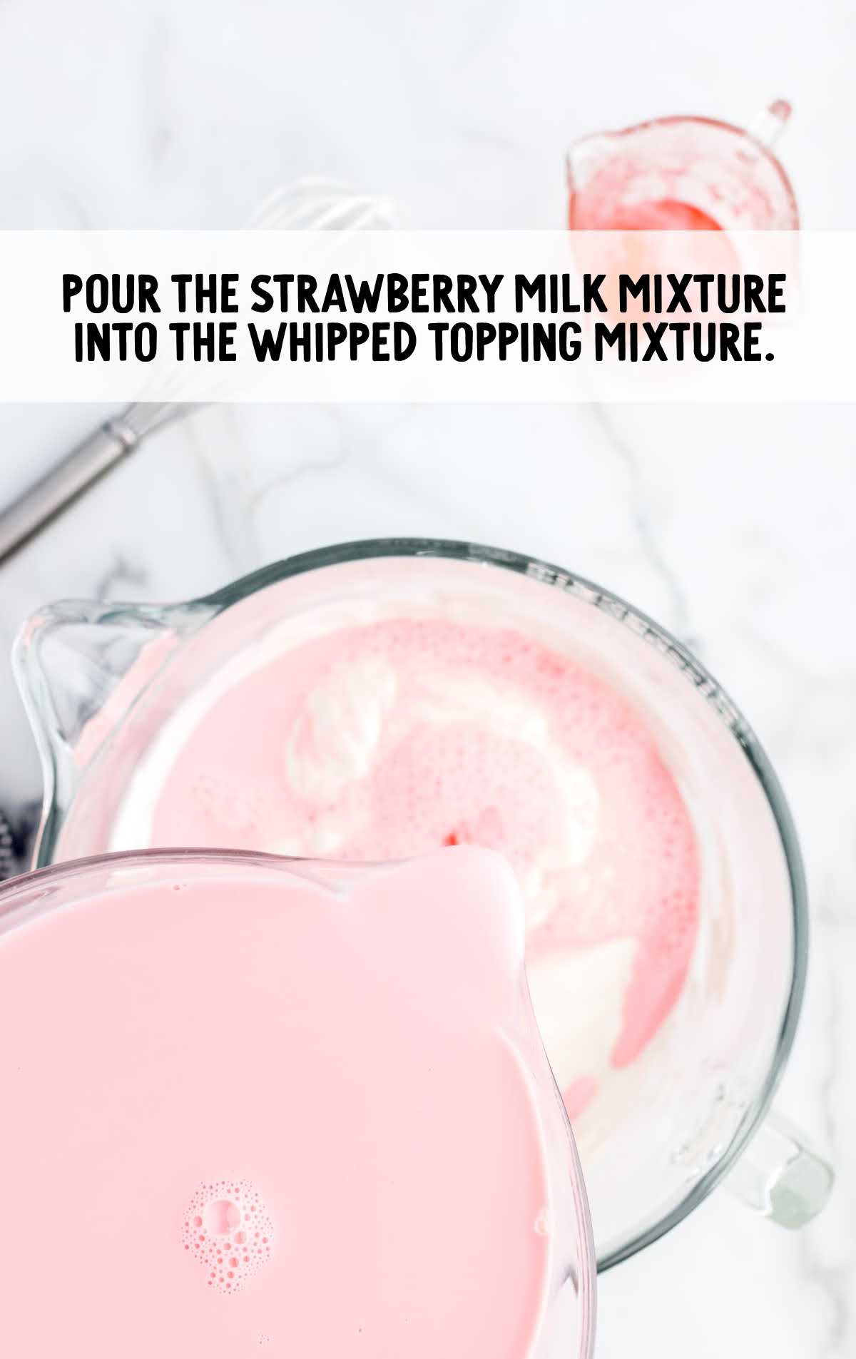 strawberry milk mixture poured into the whipped topping mixture