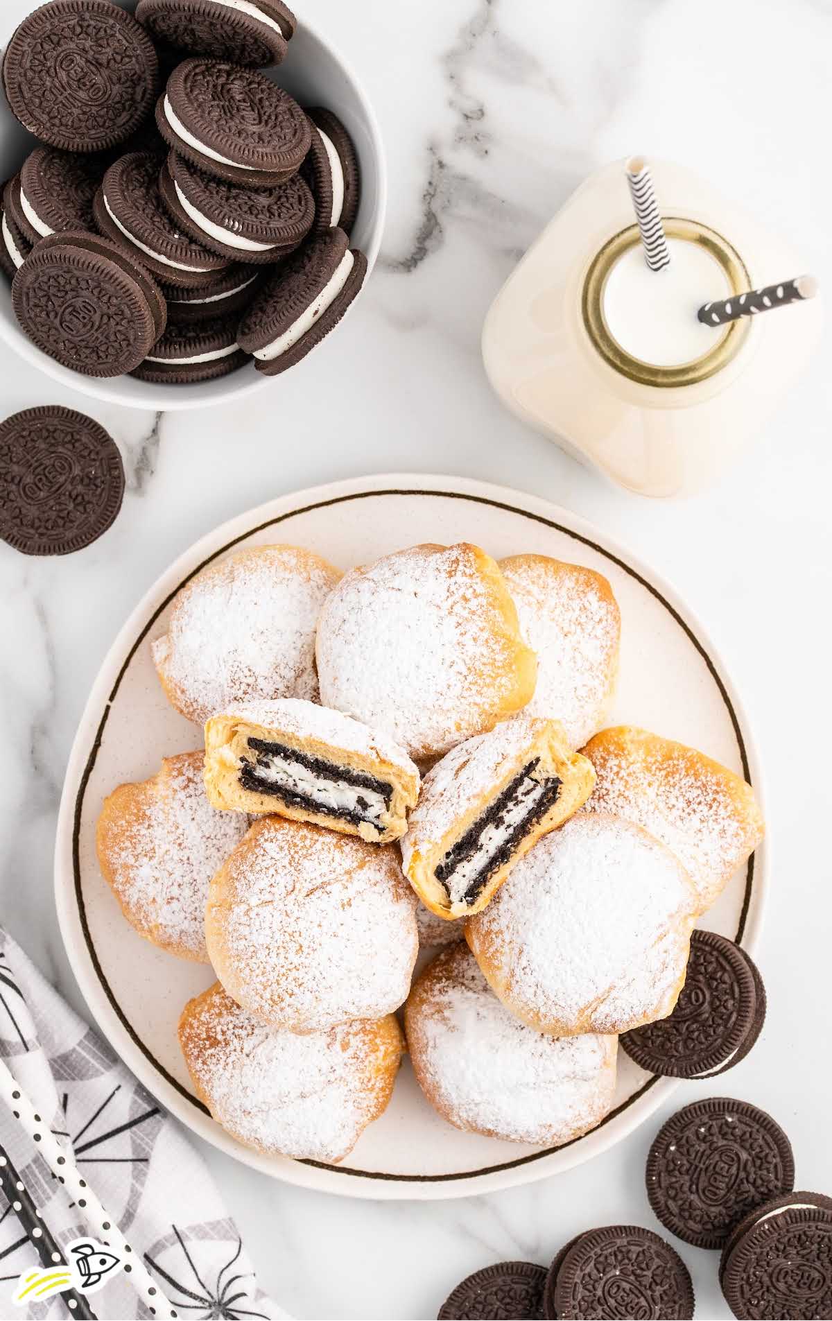 a overhead shot of Air Fried Oreos on a plate with one split in half