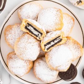 a overhead shot of Air Fried Oreos on a plate with one split in half