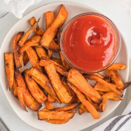 overhead shot of Air Fryer Sweet Potato Fries on a plate with ketchup