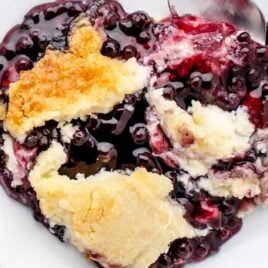 overhead shot of a piece of Blueberry Cheesecake Dump Cake on a plate