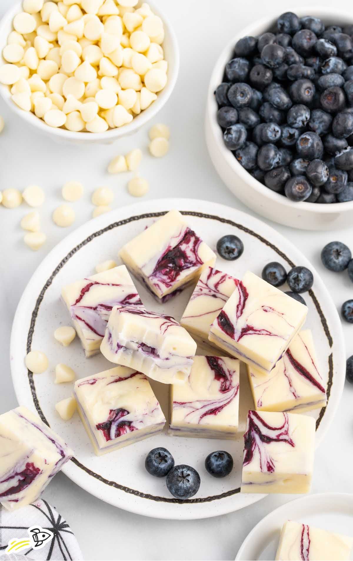 overhead shot of Blueberry Fudge on a plate with one having a bite taken out of it
