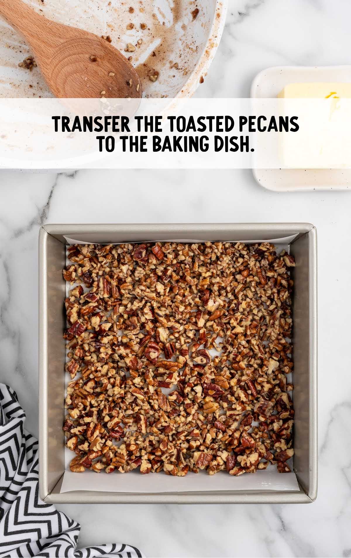 toasted pecans transferred to a baking dish
