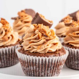a close up shot of Butterfinger Cupcakes on a tray