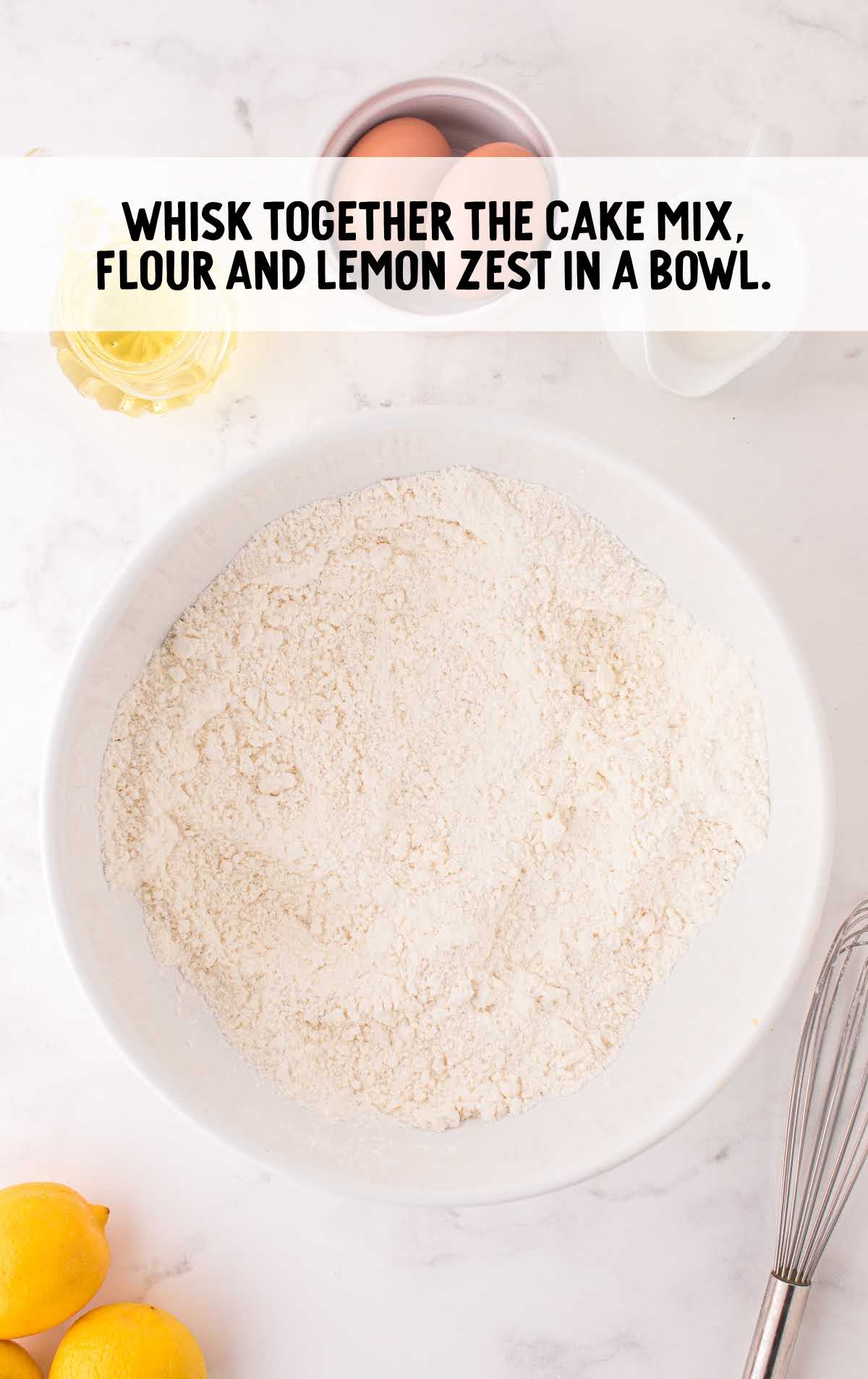 cake mix, flour, and lemon zest whisked in a bowl