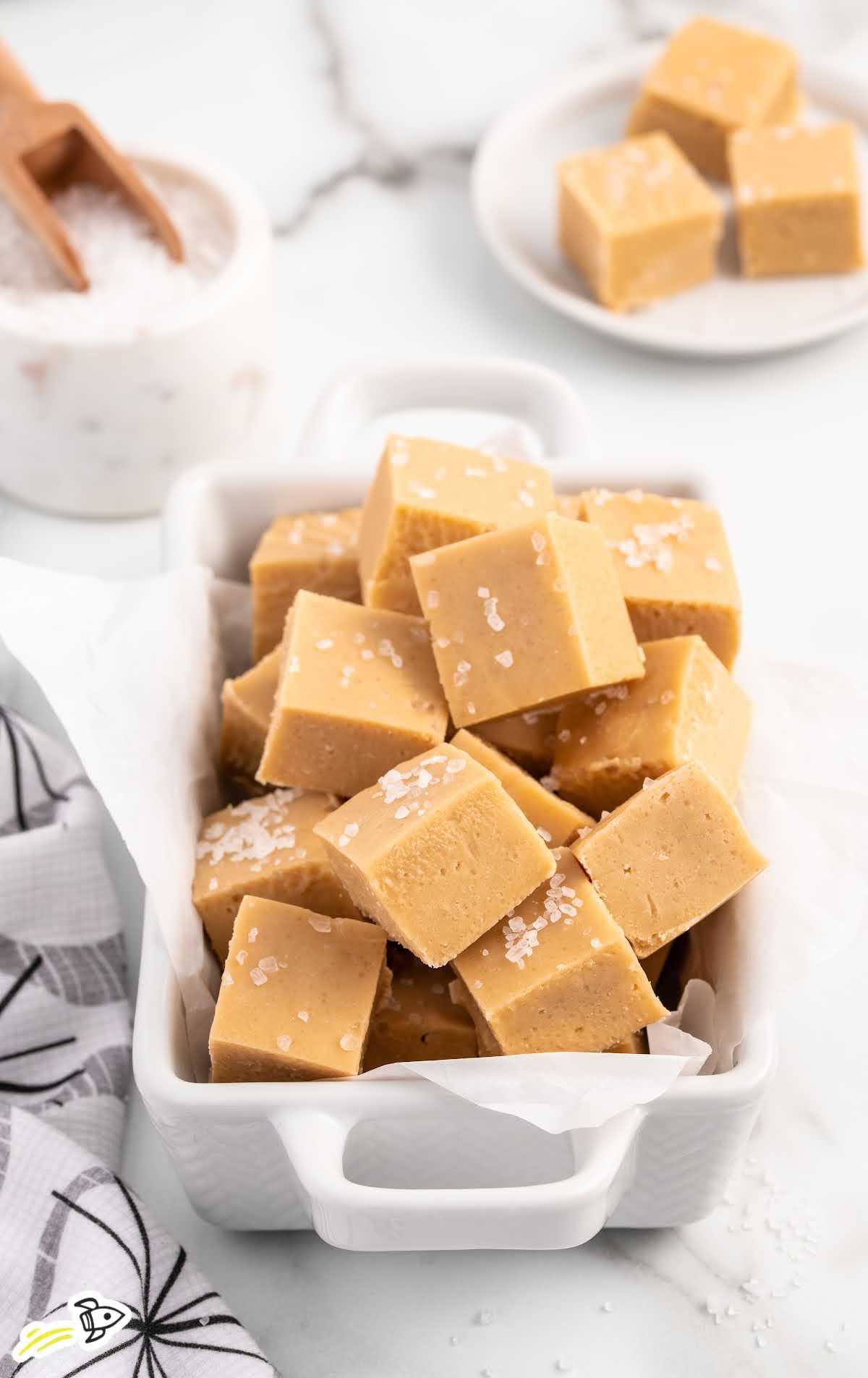 a close up shot of a bunch of Caramel Fudge stacked on top of each other in baking pan