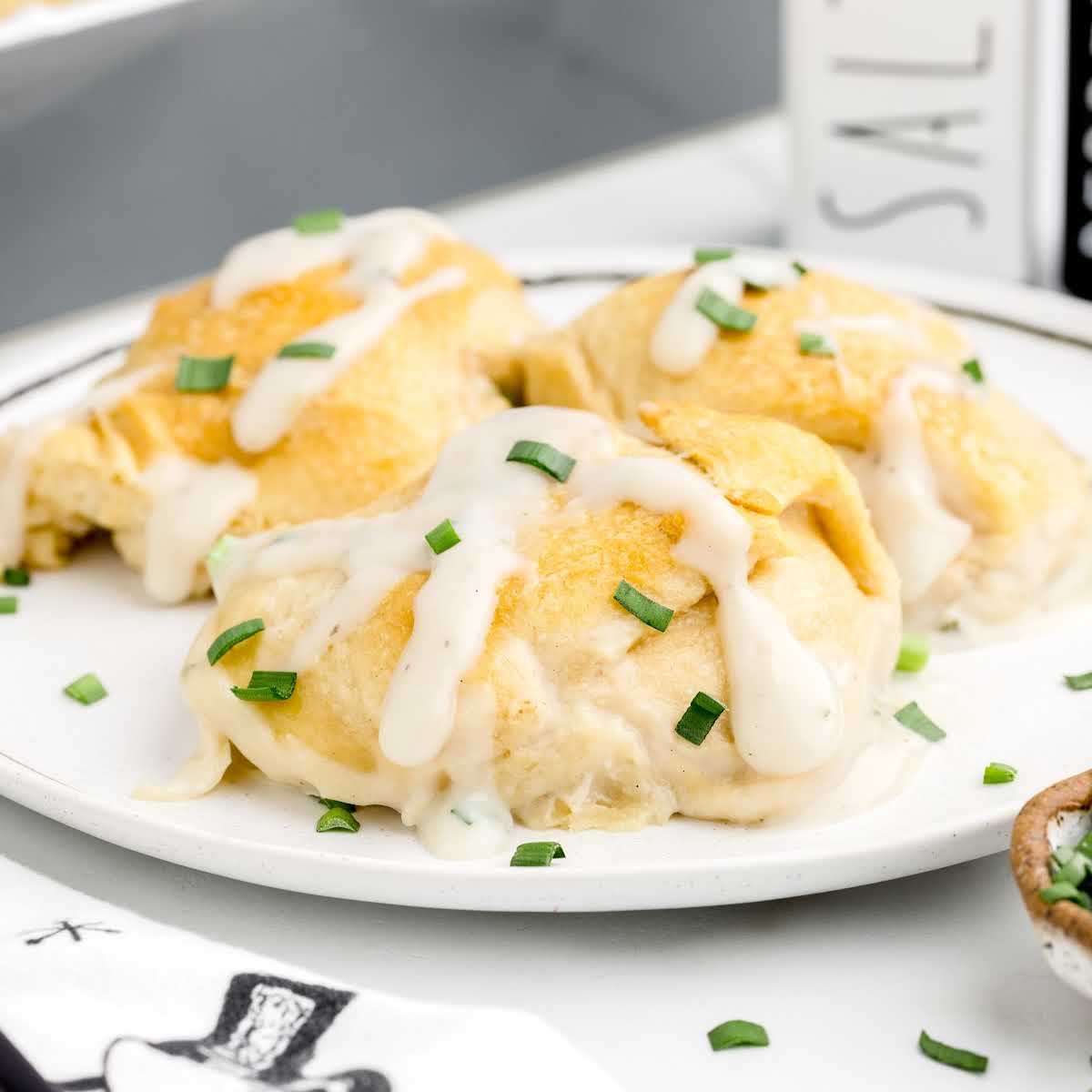 a close up shot of Chicken Crescent Rolls on a plate