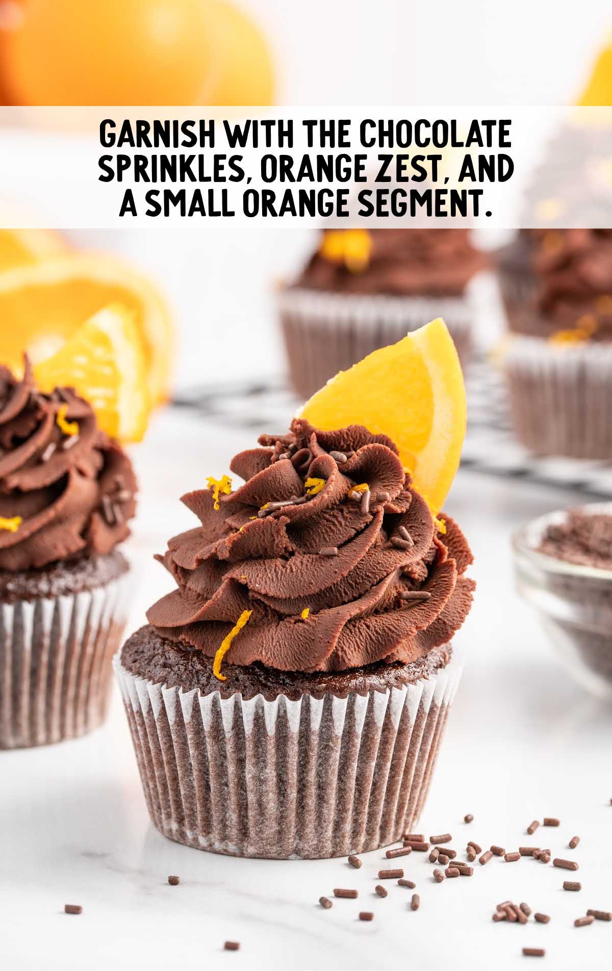 chocolate sprinkles, orange zest, and orange segment garnished