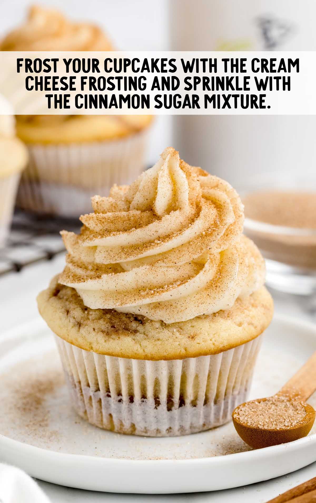 cream cheese and cinnamon sugar mixture topped on top of the cupcake
