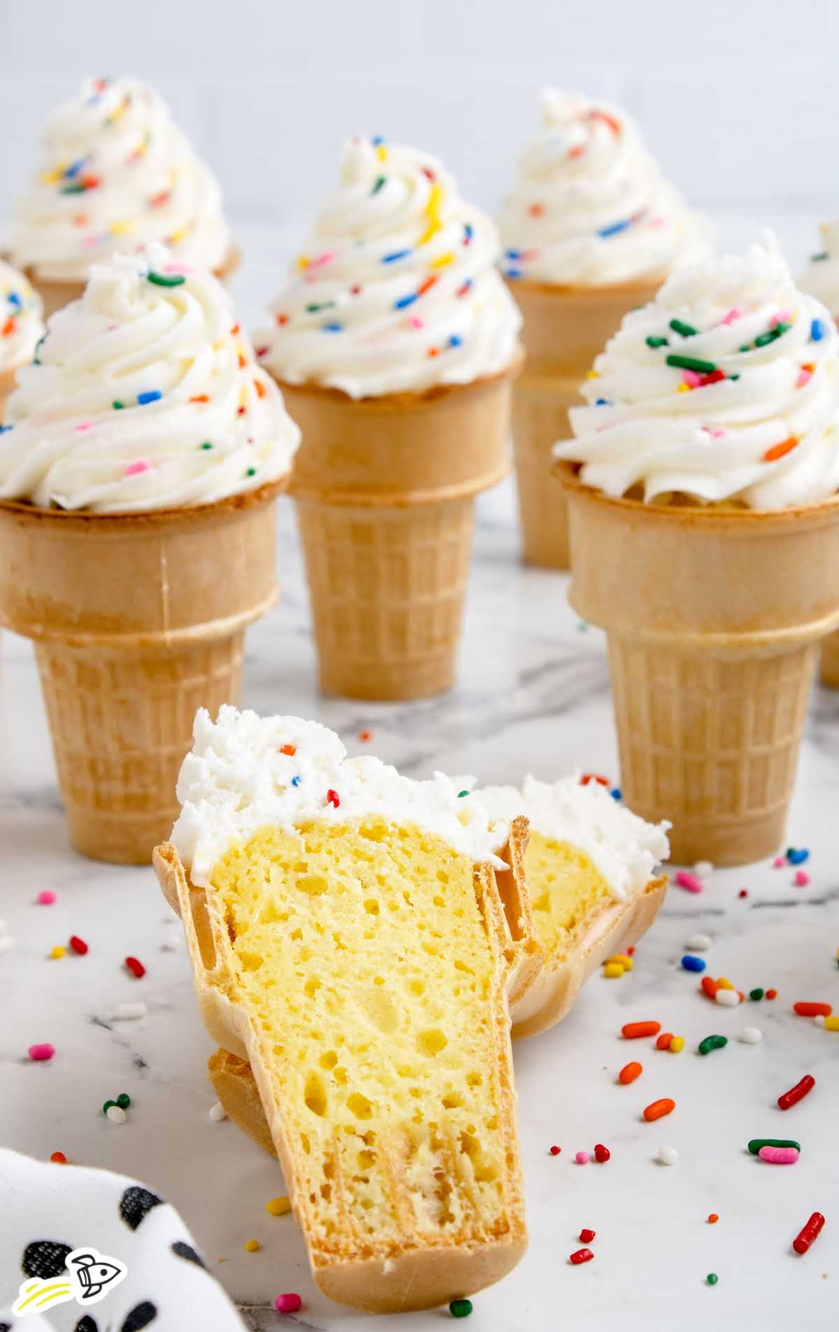 a close up shot of Ice Cream Cone Cupcakes with one split in half