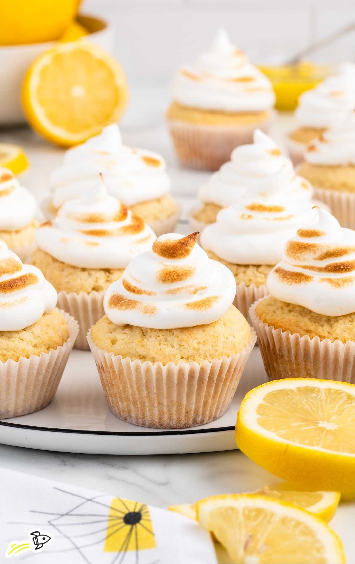 a close up shot of Lemon Meringue Cupcakes on a tray