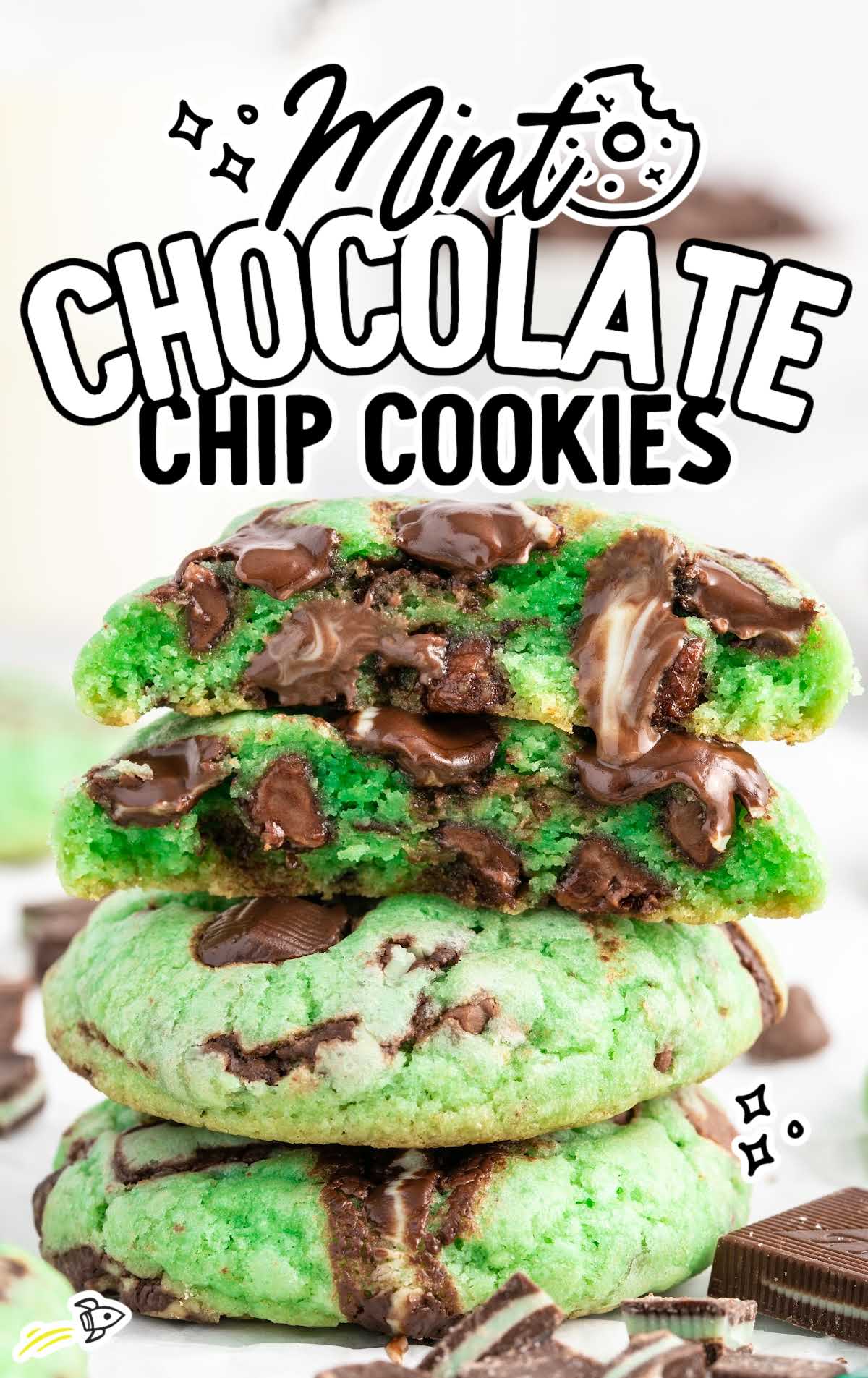 a close up shot of Mint Chocolate Chip Cookies stacked on top of each other with one split in half