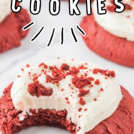 a close up shot of Red Velvet Cream Cheese Cookies with one having a bite taken out of it