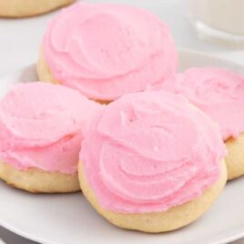 a close up shot of Sour Cream Cookies on a plate