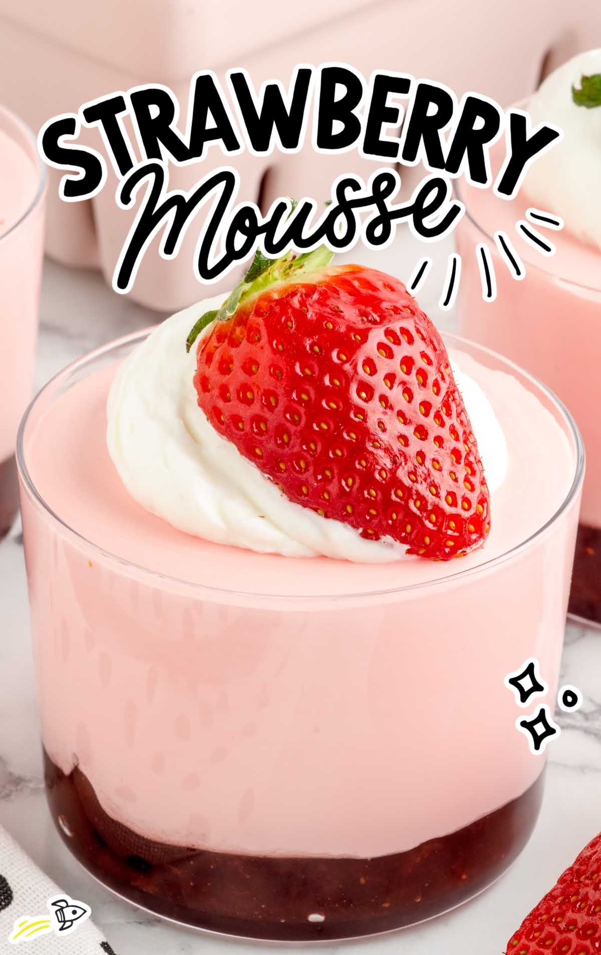 a close up shot of Strawberry Mousse in a cup