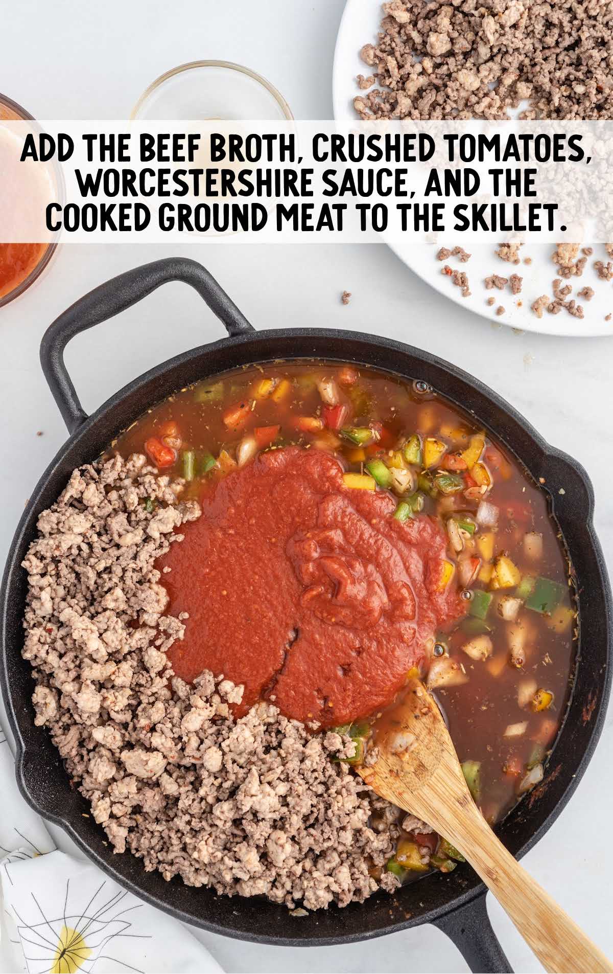 beef broth, tomatoes, Worcestershire sauce, and cooked ground meat added to a skillet