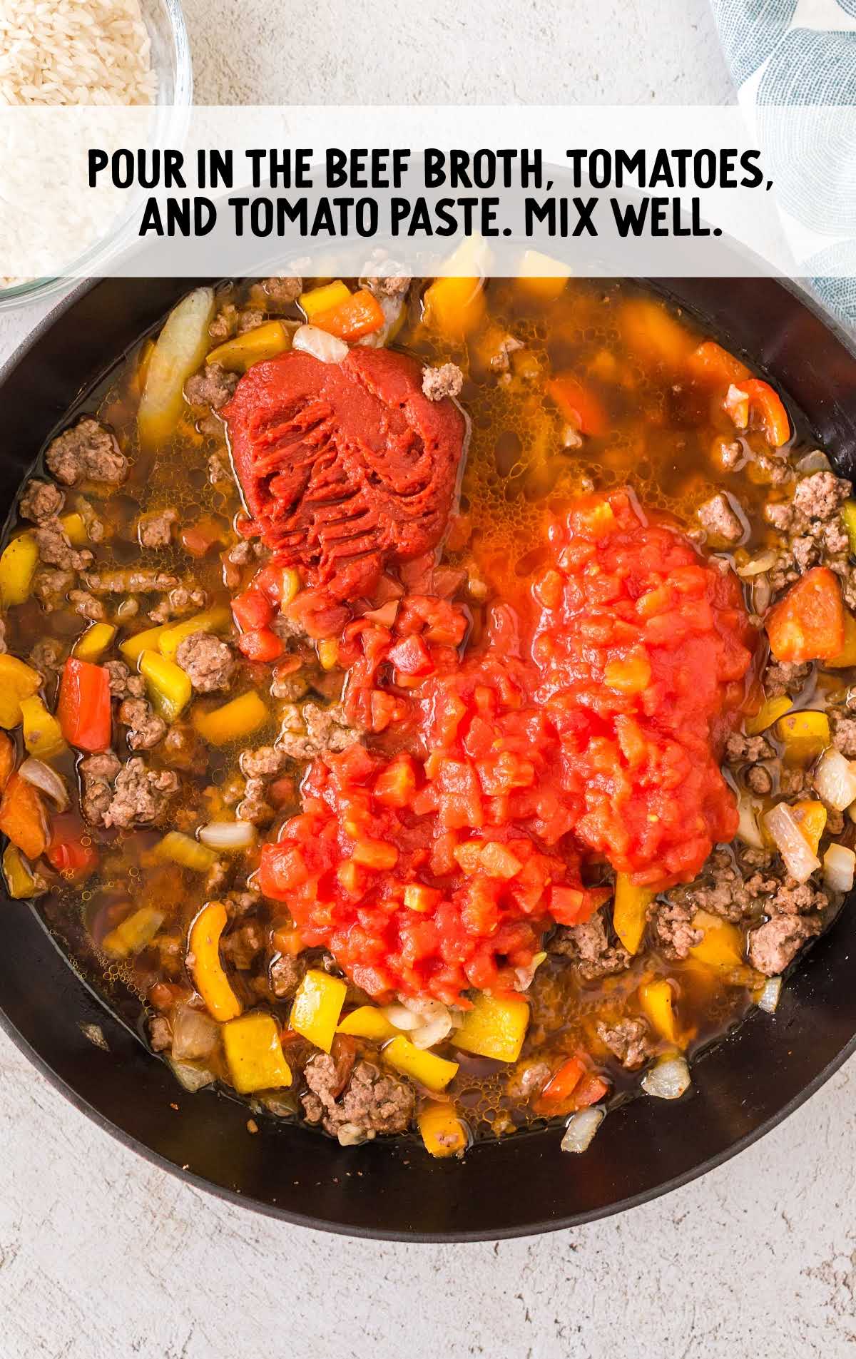 beef broth, tomatoes, and tomato paste mixed with the beef mixture