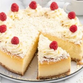 close up shot of White Chocolate Cheesecake with a slice taken out