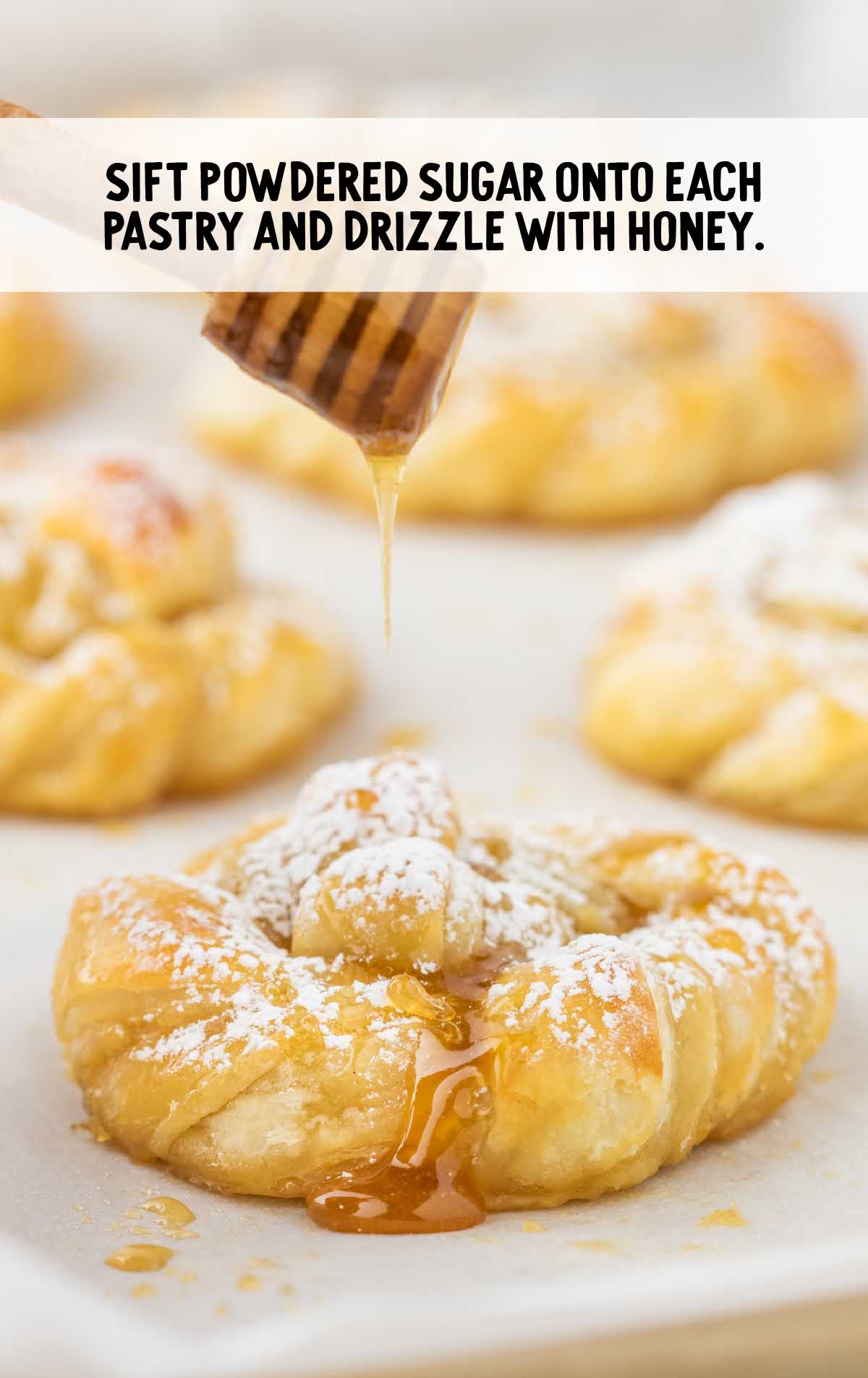 powdered sugar poured onto each pastry and drizzle with honey