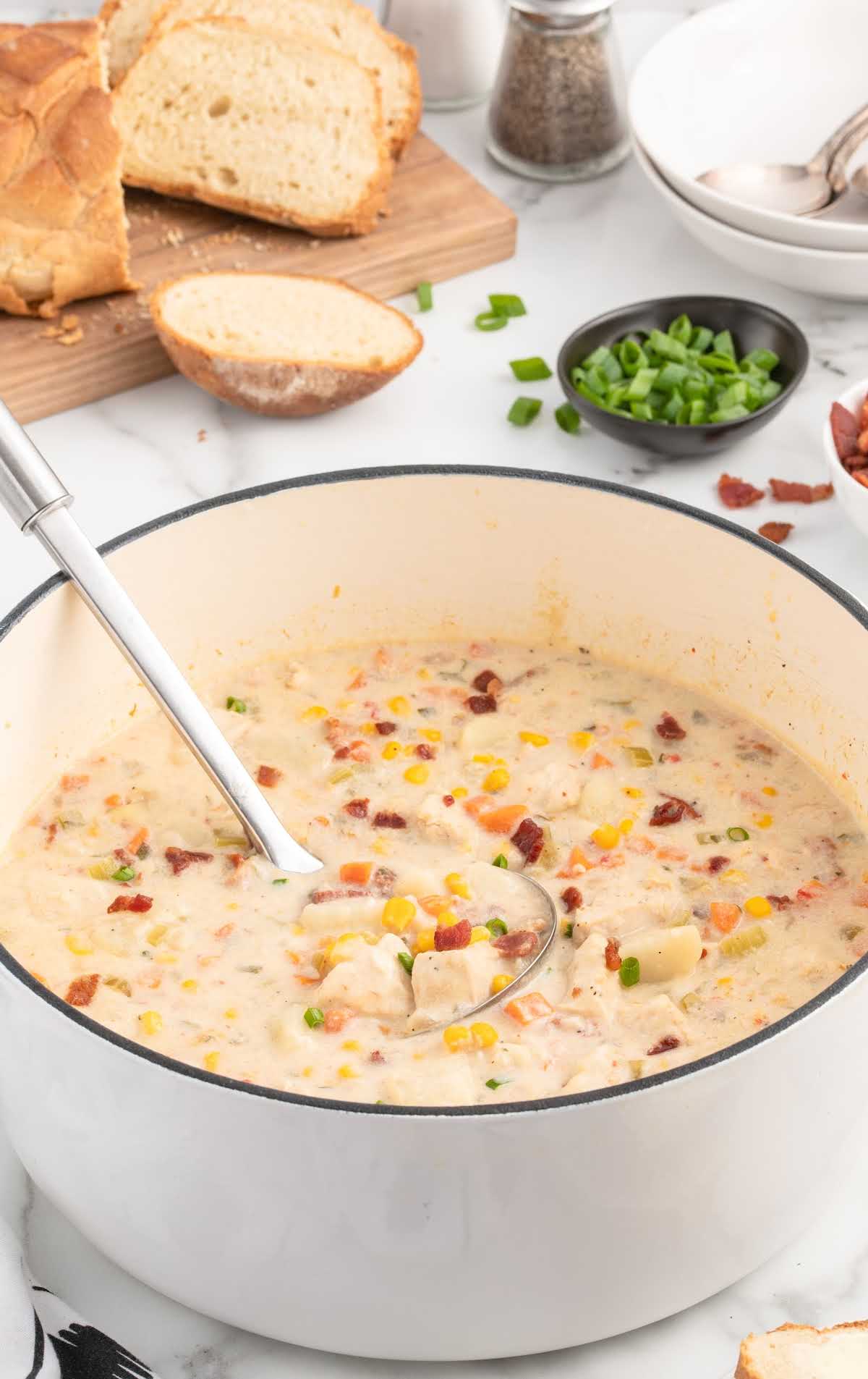 a bowl of Chicken Corn Chowder topped with a spoon