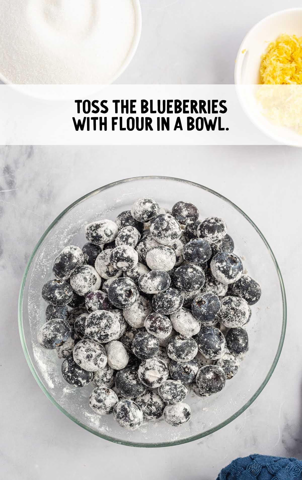 blueberries tossed with flour in a bowl