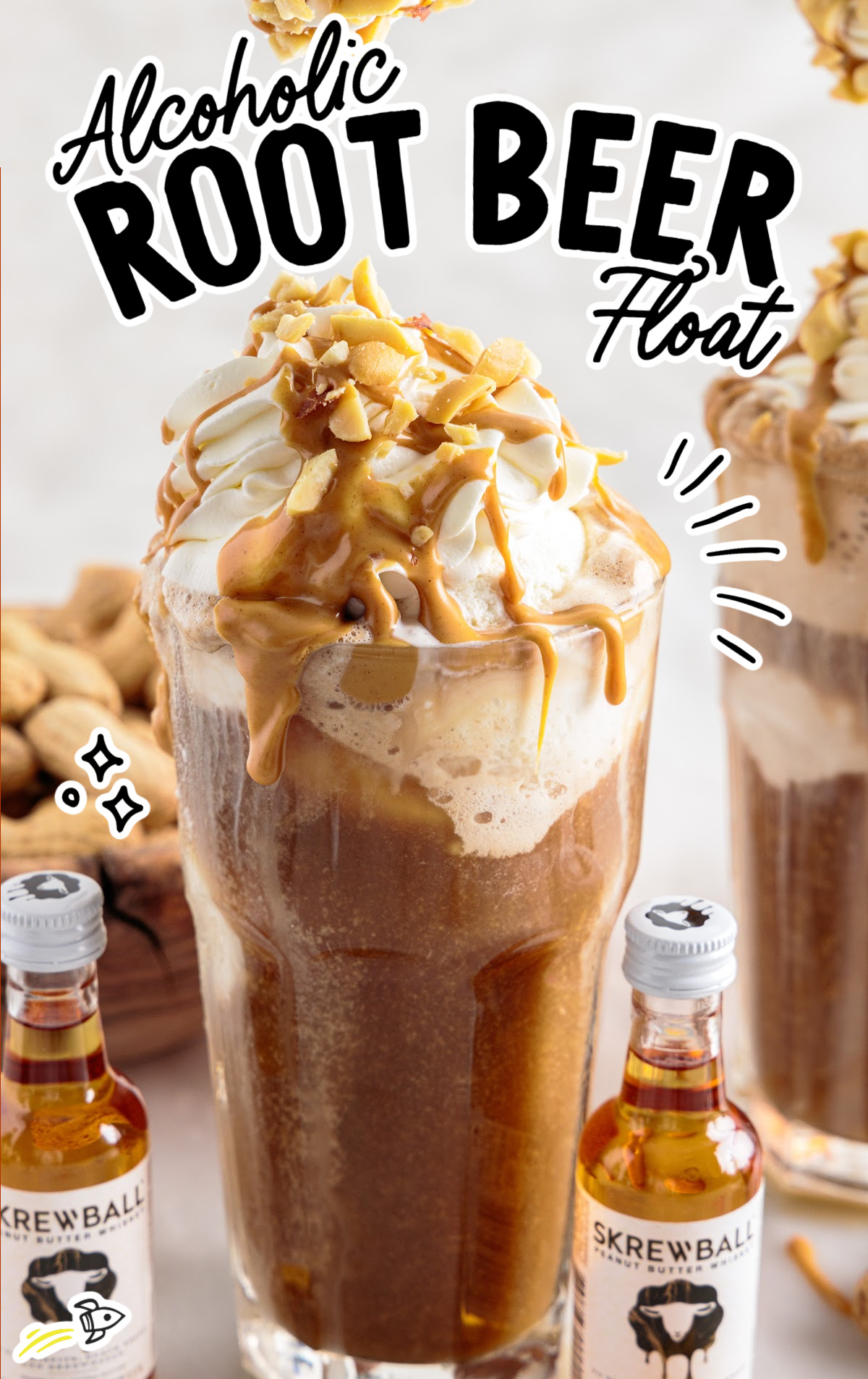 An Alcoholic Root Beer Float in a tall glass garnished with whipped cream and peanut butter drizzle. 