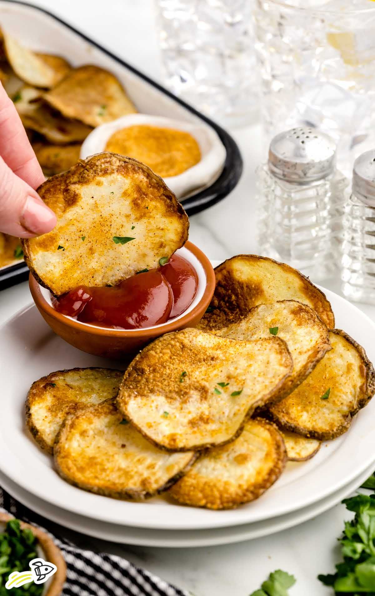 close-up shot of Air Fryer Chips on a plate with a side of ketchup