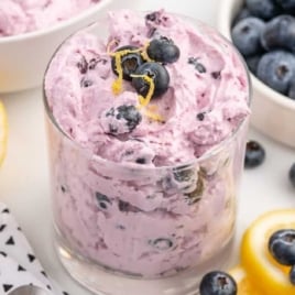 a cup of Blueberry Fluff topped with blueberries and lemon zest