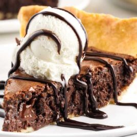 a close-up shot of a slice of Brownie Pie on a plate