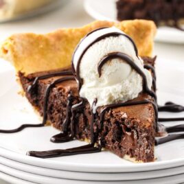a close-up shot of a slice of Brownie Pie on a plate