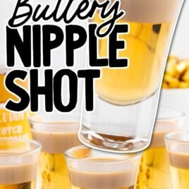 a close up shot of Buttery Nipple Shots with one being mixed with a spoon