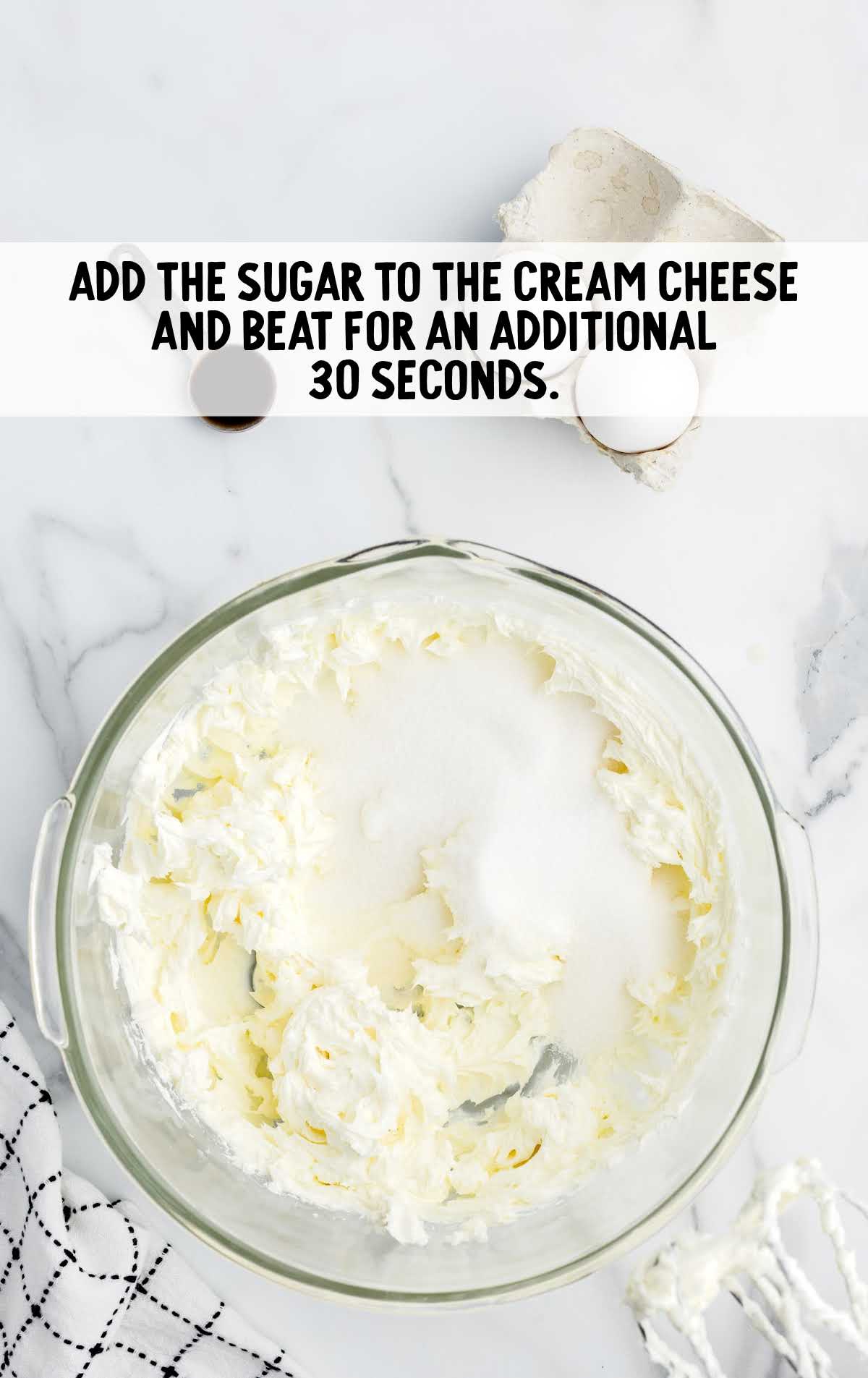 sugar and cream cheese combined in a bowl