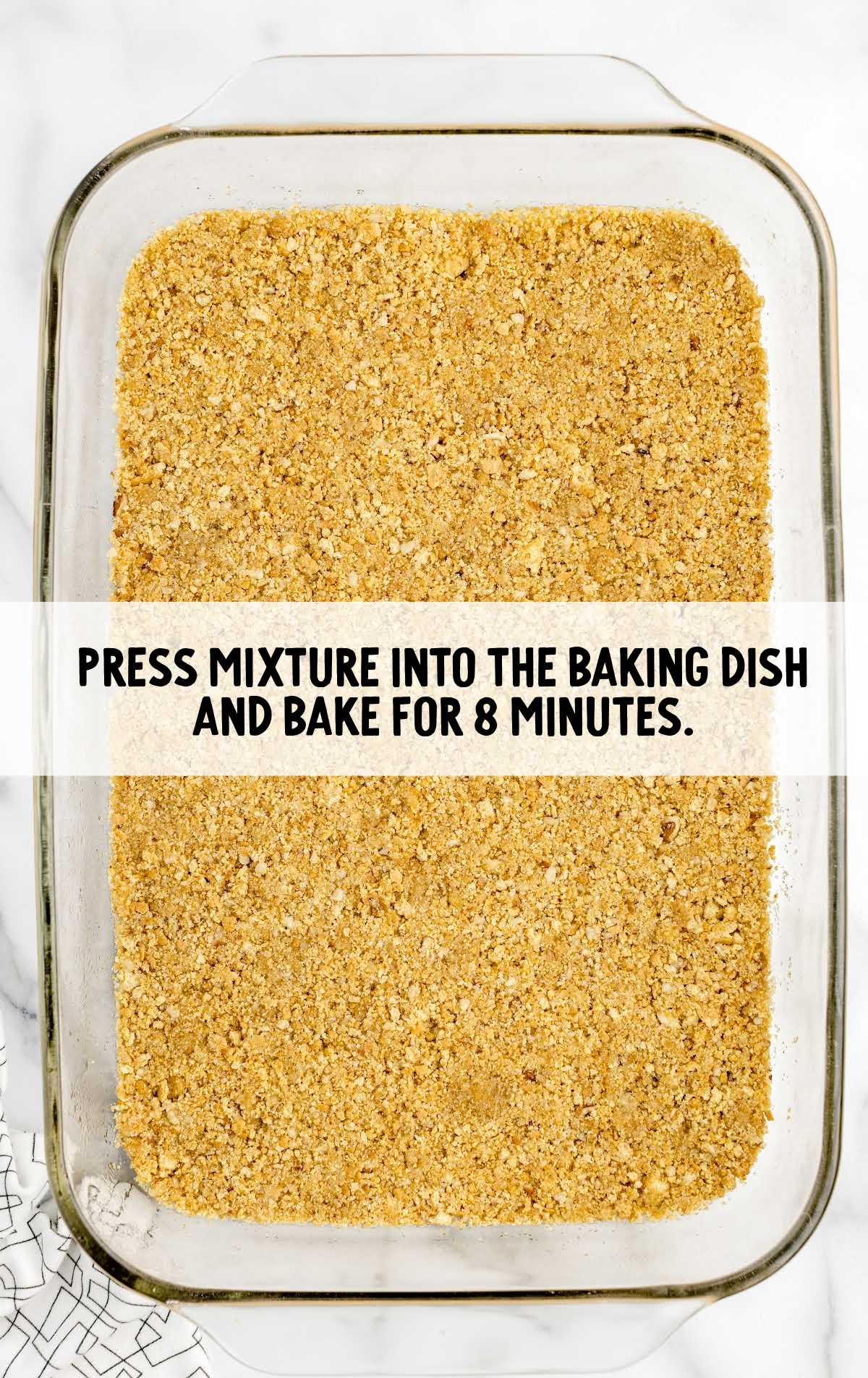 crust mixture spread in a baking dish