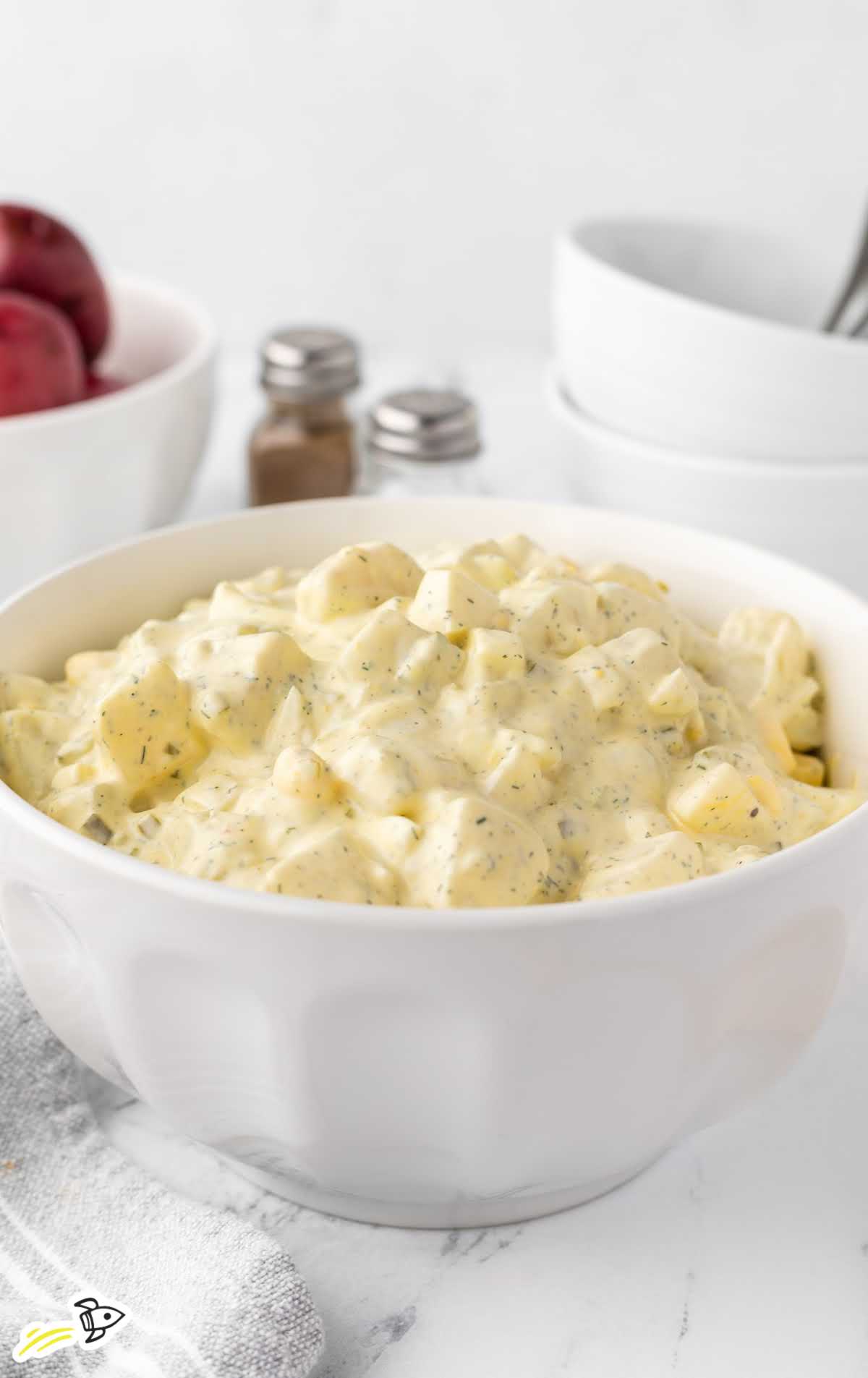 a close-up shot of Creamy Potato Salad in a bowl