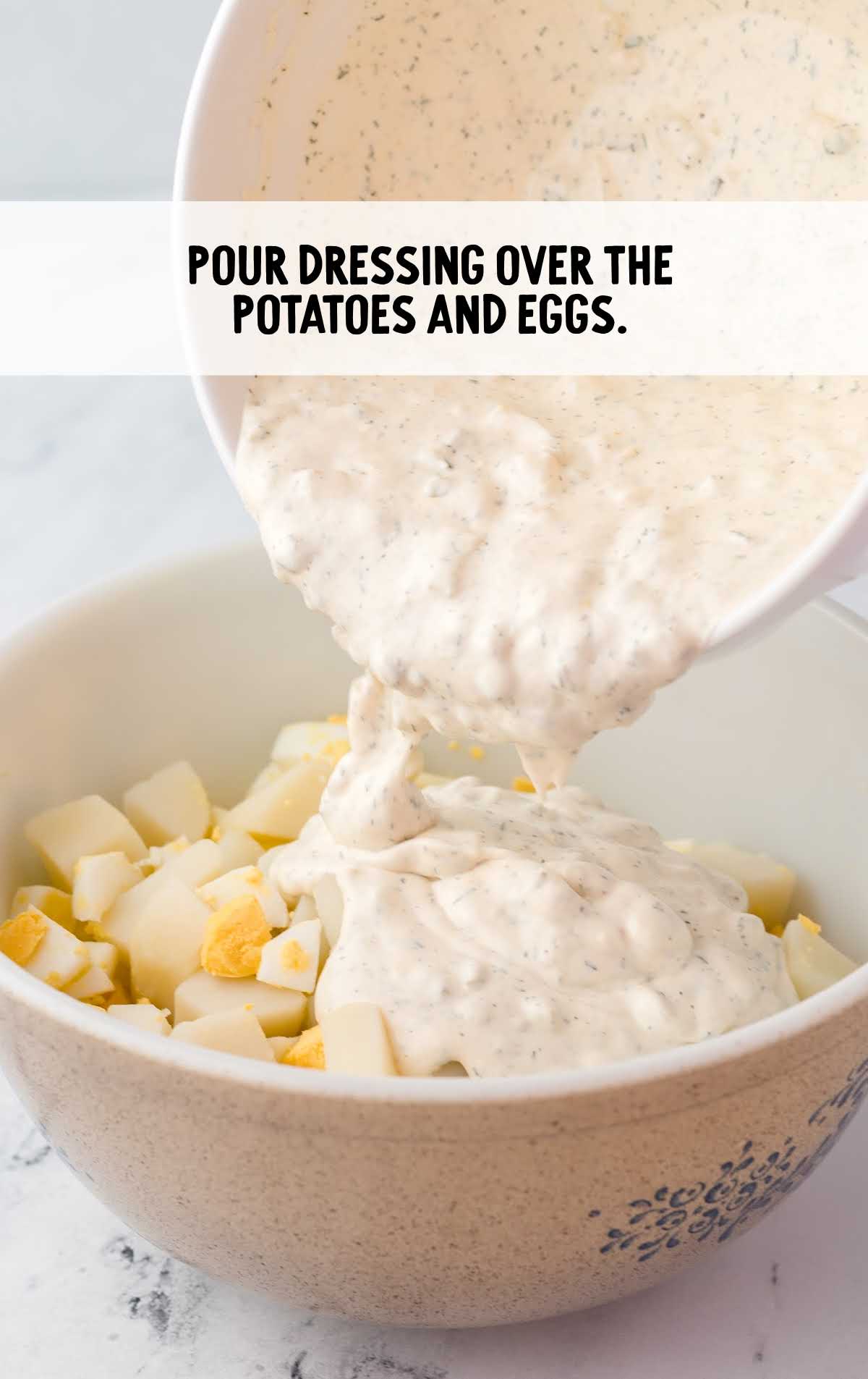 salad dressing poured the potatoes and eggs in a bowl