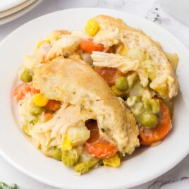 a close up shot of a piece of Easy Chicken Pot Pie on a plate