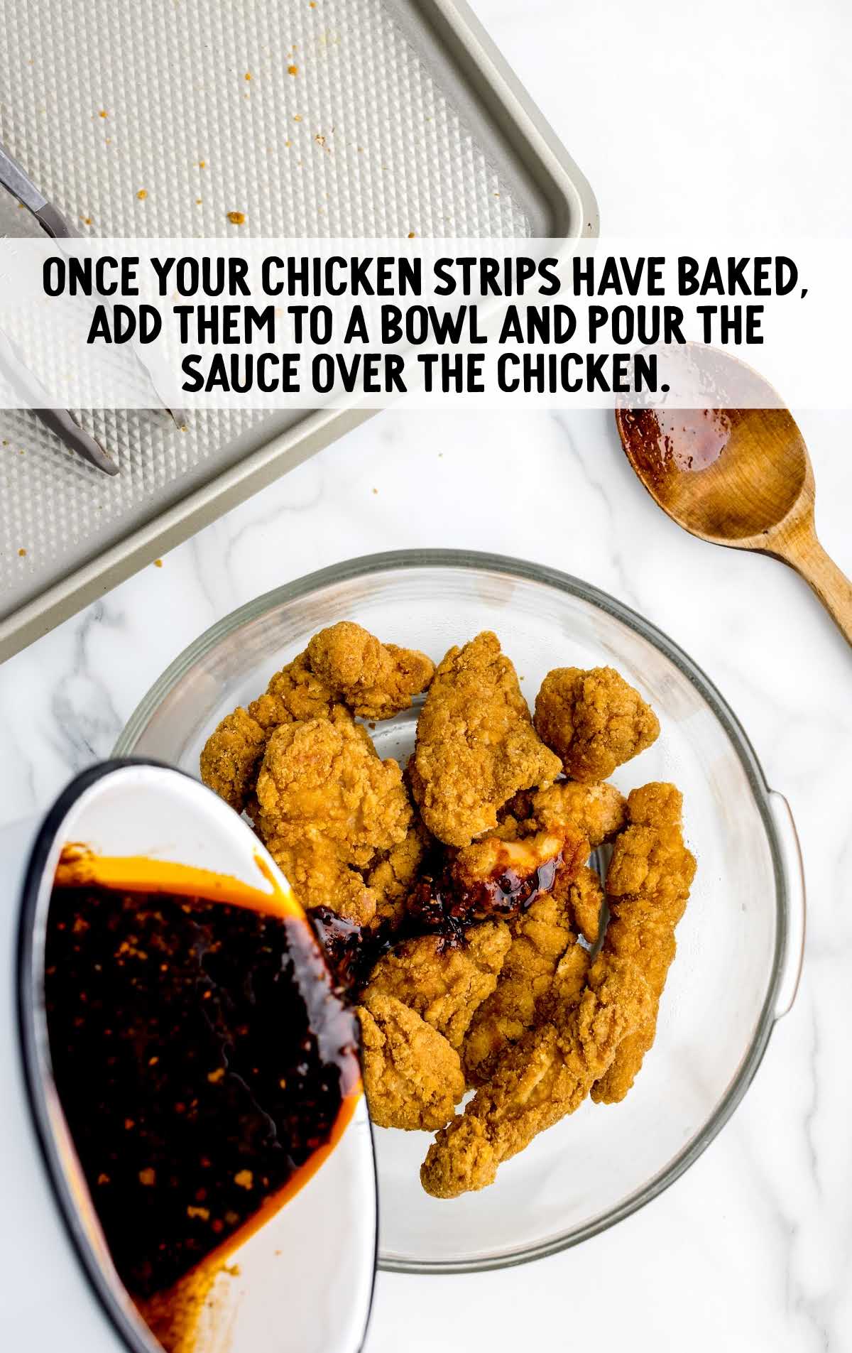 sauce poured over the chicken strips