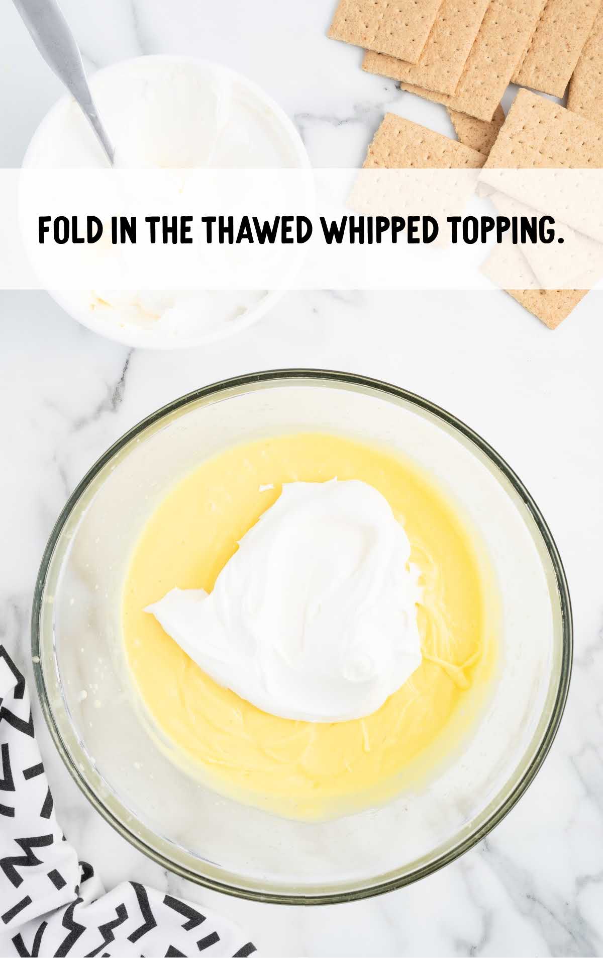 whipped topping folded in the bowl