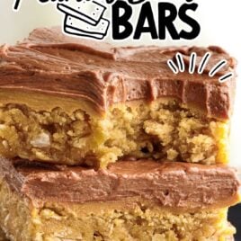 a close up shot of Lunch Lady Peanut Butter Bars stacked on top of each other on a plate with one having a bite taken out of it