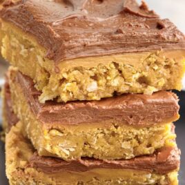 a close up shot of Lunch Lady Peanut Butter Bars stacked on top of each other