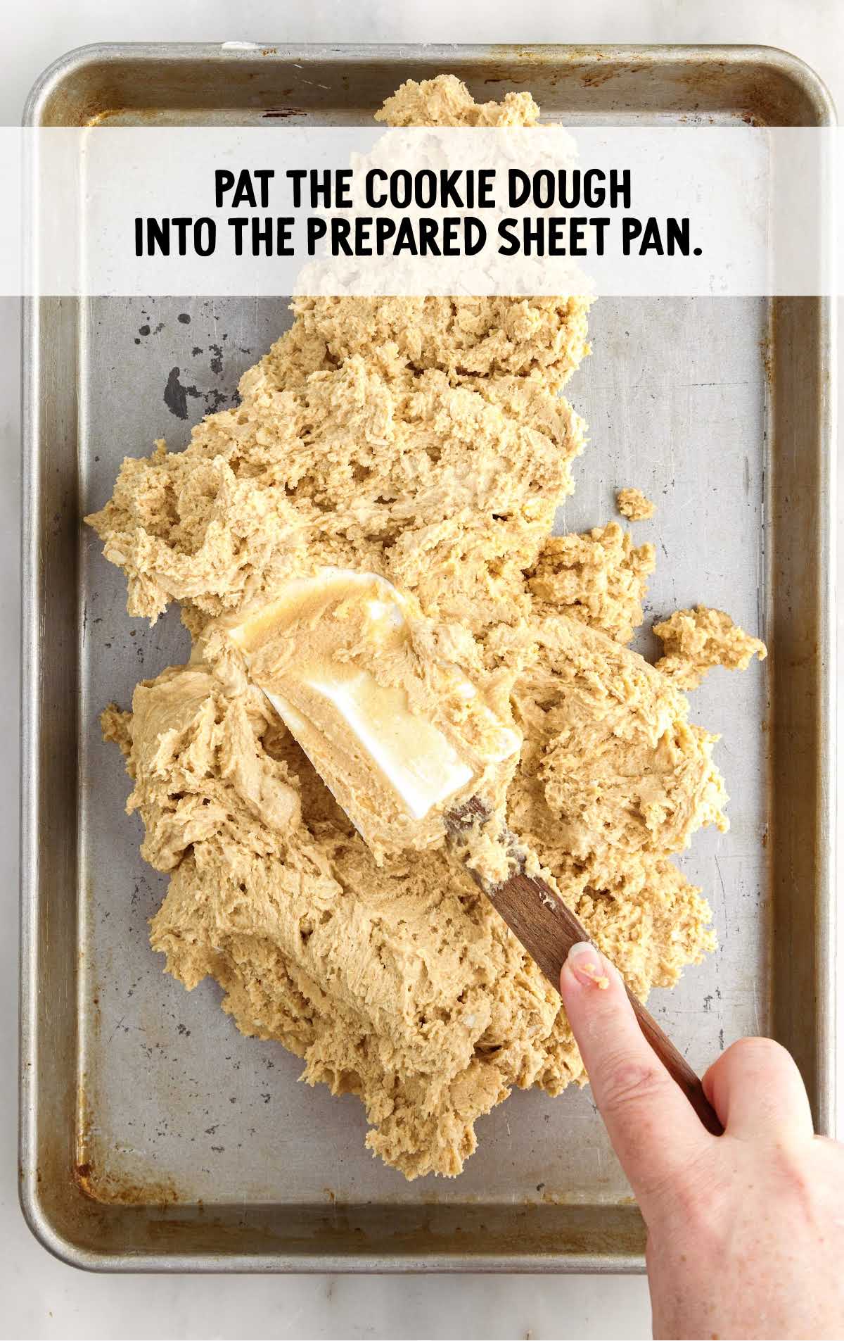cookie dough patted into the sheet pan