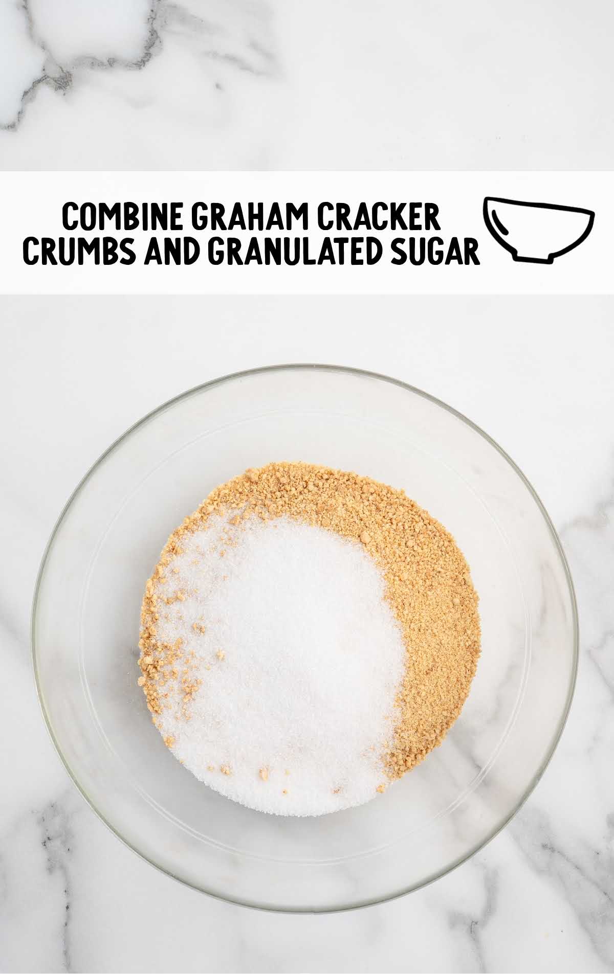 graham cracker crumbs and sugar added to a bowl