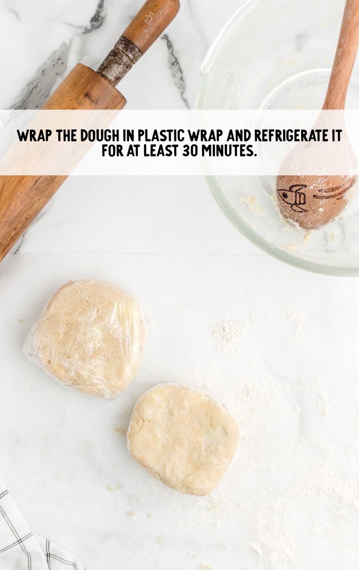 pie crust dough wrapped in plastic wrap
