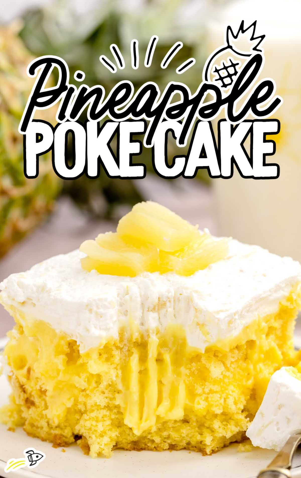 a close-up shot of a slice of Pineapple Poke Cake with a piece taken by a fork