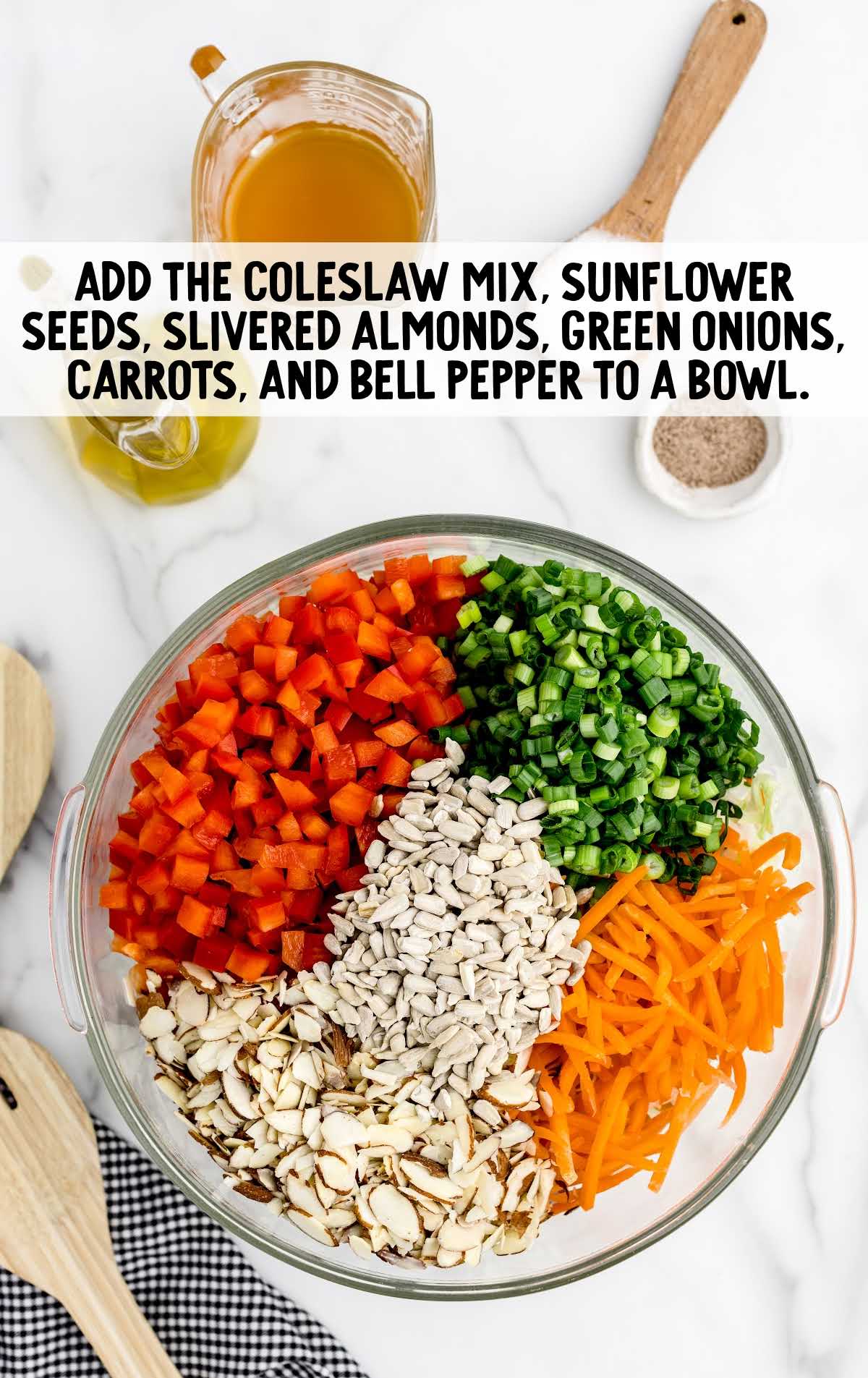 Coleslaw mix, sunflower seed, almonds, green onions, carrots, and bell peppers combined together
