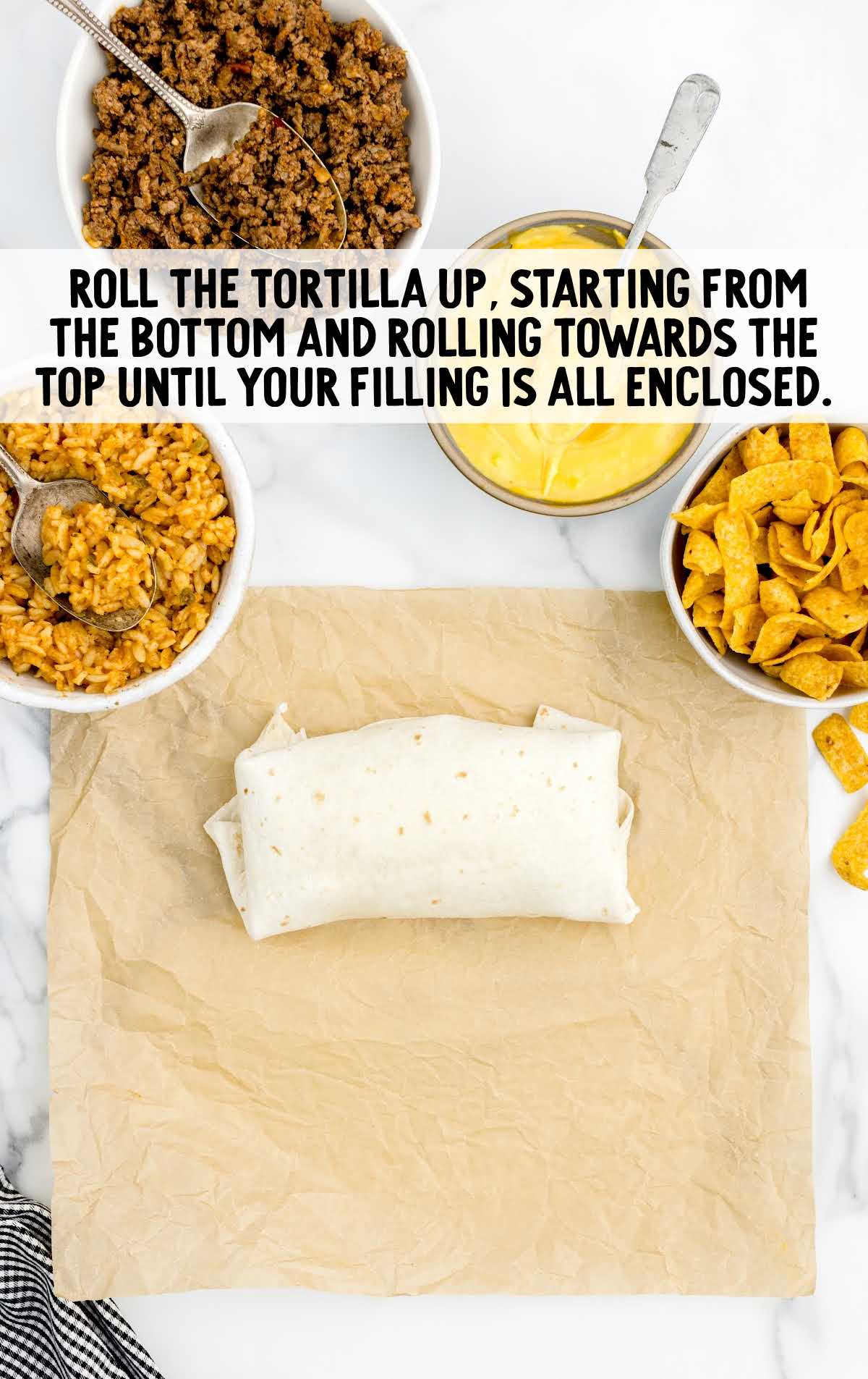 burrito being rolled until closed