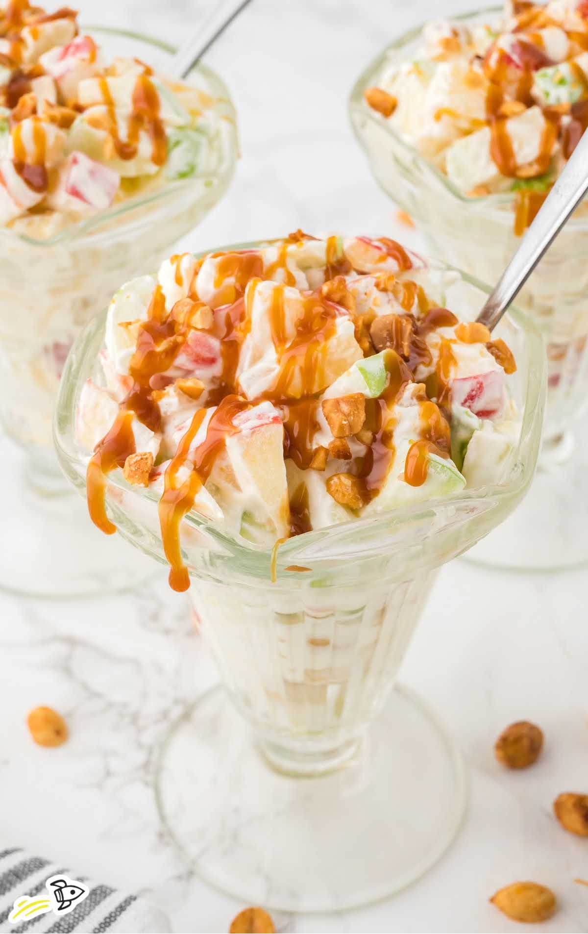 a close-up shot of Taffy Apple Salad in a tall glass cup