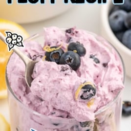 a cup of Blueberry Fluff topped with blueberries and lemon zest