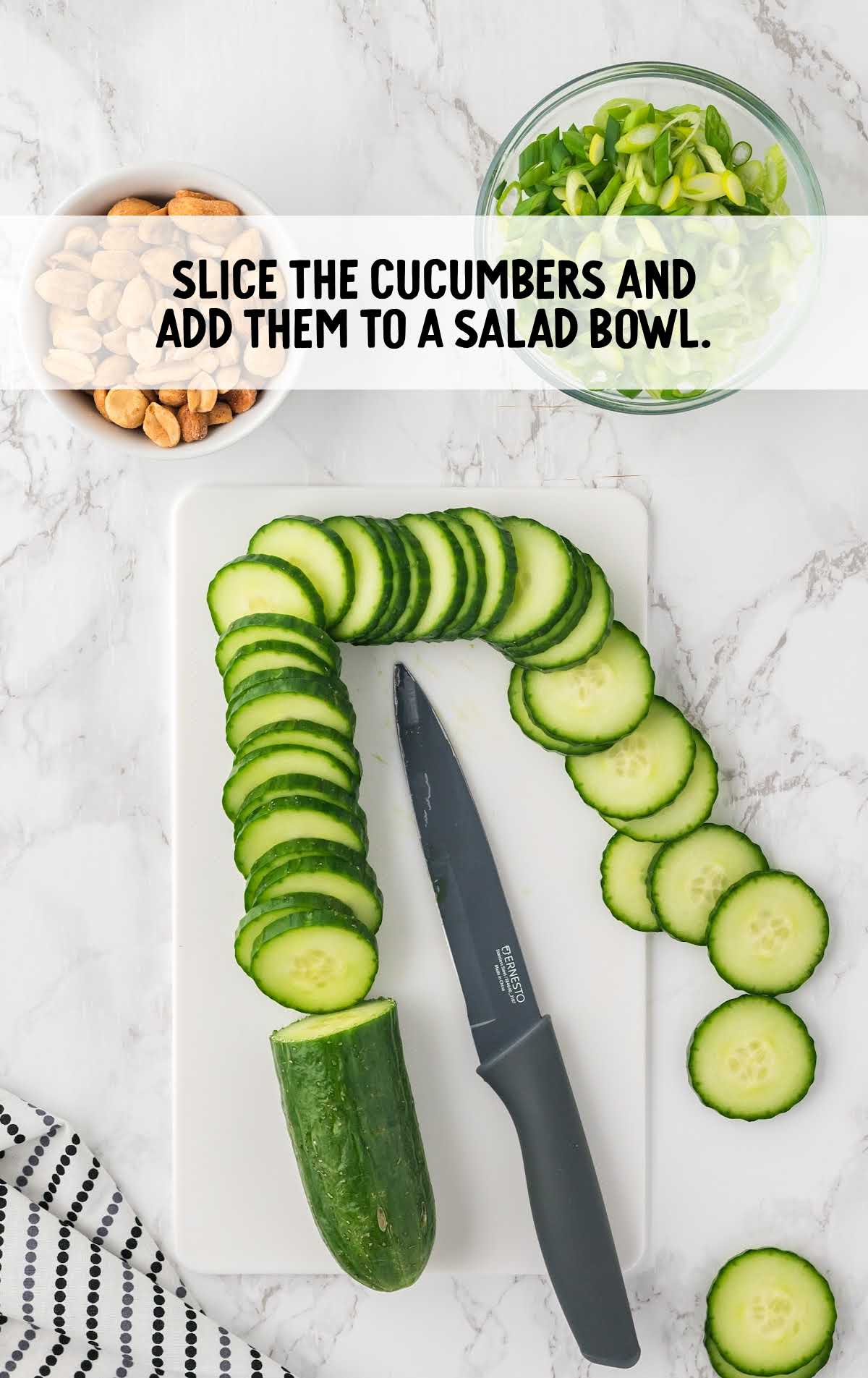 cucumbers sliced and added to the salad bowl