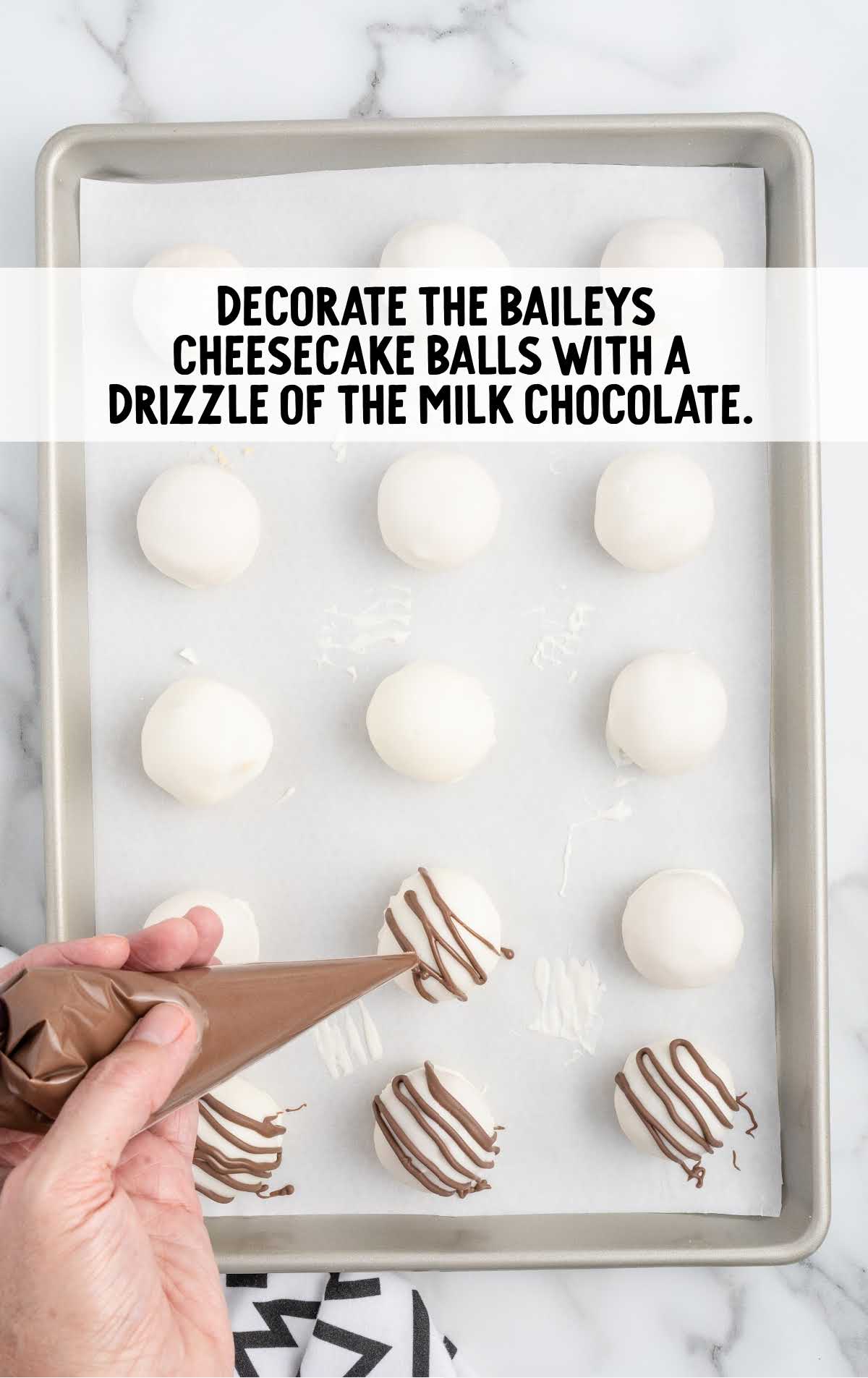 cheesecake balls decorated with milk chocolate